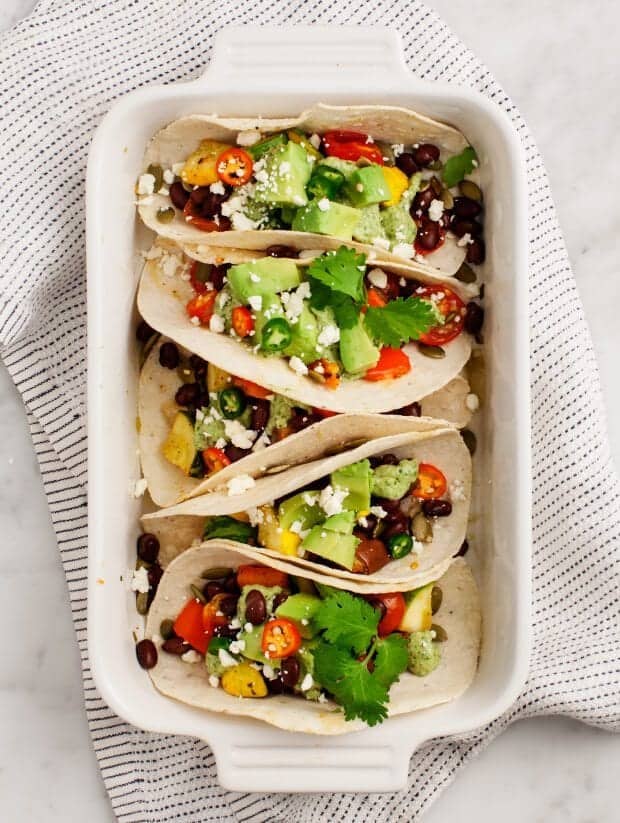 Roasted Vegetable Tacos with Creamy Avocado Tomatillo Salsa / loveandlemons.com